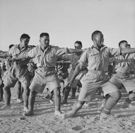 Māori Battalion performing a haka, probably in Egypt.